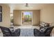 Relaxing patio with wicker chairs and access to the backyard at 17025 E La Montana Dr # 130, Fountain Hills, AZ 85268