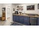 Convenient wet bar with dark cabinets and granite countertop at 17025 E La Montana Dr # 130, Fountain Hills, AZ 85268