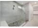 Spa-like shower with pebble floor and built-in seat at 17184 W Mountainair St, Surprise, AZ 85388