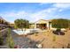 Relaxing backyard featuring a pool, spa, and desert landscaping at 17535 E Silver Sage Ln, Rio Verde, AZ 85263