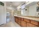 Double vanity bathroom with a large shower and granite countertops at 17535 E Silver Sage Ln, Rio Verde, AZ 85263