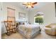 Bright bedroom with a comfortable bed, rocking chair, and large window at 17535 E Silver Sage Ln, Rio Verde, AZ 85263