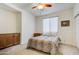 Guest bedroom with a queen bed and built-in cabinets at 17535 E Silver Sage Ln, Rio Verde, AZ 85263