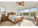 Bright bedroom with a wooden bed frame and large windows at 17535 E Silver Sage Ln, Rio Verde, AZ 85263