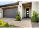 Inviting entryway with a modern door and landscaping at 17535 E Silver Sage Ln, Rio Verde, AZ 85263