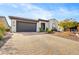 Beautiful home exterior with a large driveway and landscaping at 17535 E Silver Sage Ln, Rio Verde, AZ 85263