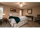 Main bedroom with king-size bed and ceiling fan at 17826 N Buntline Dr, Sun City West, AZ 85375