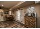 View of kitchen's French doors and wood cabinet at 17826 N Buntline Dr, Sun City West, AZ 85375