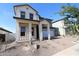 Attractive two-story home showcasing a welcoming front porch with sturdy columns and a well-maintained front yard at 1932 W Rowel Rd, Phoenix, AZ 85085