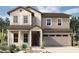 Two-story home with light-colored siding, brown accents, and a three-car garage at 1932 W Rowel Rd, Phoenix, AZ 85085
