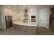 Spacious kitchen features a large island, stainless steel appliances, and plenty of cabinet space at 1932 W Rowel Rd, Phoenix, AZ 85085