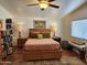 Bedroom with wooden bed frame and ceiling fan at 2233 E Behrend Dr # 93, Phoenix, AZ 85024