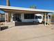 Mobile home with carport and desert landscaping at 2233 E Behrend Dr # 93, Phoenix, AZ 85024