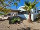 Inviting exterior with covered carport and desert landscaping at 2233 E Behrend Dr # 93, Phoenix, AZ 85024