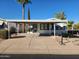 Mobile home with carport and landscaped yard at 2233 E Behrend Dr # 93, Phoenix, AZ 85024