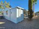 Mobile home with covered porch and side yard at 2233 E Behrend Dr # 93, Phoenix, AZ 85024