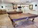 Community game room with two pool tables and seating at 2233 E Behrend Dr # 93, Phoenix, AZ 85024
