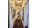 Hallway with carpet runner and framed artwork on the walls at 2233 E Behrend Dr # 93, Phoenix, AZ 85024