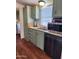Kitchen features stainless steel appliances and green cabinets at 2233 E Behrend Dr # 93, Phoenix, AZ 85024