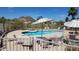 Sparkling community pool with umbrellas and seating at 2233 E Behrend Dr # 93, Phoenix, AZ 85024