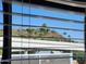 Window view of palm trees and desert landscape at 2233 E Behrend Dr # 93, Phoenix, AZ 85024