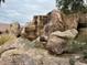 Relaxing waterfall feature nestled among desert rocks and plants at 2233 E Behrend Dr # 93, Phoenix, AZ 85024