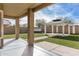 Landscaped backyard with artificial turf, a gazebo, and a covered patio at 224 S 151St Ave, Goodyear, AZ 85338