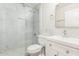 Modern bathroom with white vanity, marble tile, and glass shower at 224 S 151St Ave, Goodyear, AZ 85338