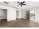 Main bedroom with wood-look floors, private balcony and ensuite bathroom at 224 S 151St Ave, Goodyear, AZ 85338