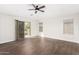Main bedroom with wood-look floors, private balcony, and window blinds at 224 S 151St Ave, Goodyear, AZ 85338