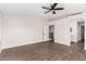 Spacious bedroom with wood-look floors and an ensuite bathroom at 224 S 151St Ave, Goodyear, AZ 85338