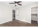 Bedroom with wood-look floors, ceiling fan and access to loft at 224 S 151St Ave, Goodyear, AZ 85338