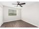 Well lit bedroom with wood-look floors and window blinds at 224 S 151St Ave, Goodyear, AZ 85338