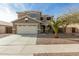 Two-story house with attached garage and desert landscaping at 224 S 151St Ave, Goodyear, AZ 85338