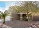 House exterior with covered entryway and landscaping at 224 S 151St Ave, Goodyear, AZ 85338
