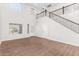 Spacious living room with high ceilings, hardwood floors, and a staircase at 224 S 151St Ave, Goodyear, AZ 85338