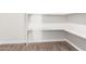 White shelving unit in a storage or pantry area at 224 S 151St Ave, Goodyear, AZ 85338