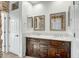 Elegant bathroom with double vanity and large mirrors at 2446 W Myopia Dr, Anthem, AZ 85086