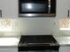 Stainless steel microwave above a gas cooktop at 2446 W Myopia Dr, Anthem, AZ 85086