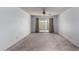 Bright living room featuring a ceiling fan and access to patio at 3013 W Redfield Rd, Phoenix, AZ 85053