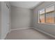 Cozy bedroom featuring neutral carpet, natural light from the windows, and a closet at 32470 N 134Th Ln, Peoria, AZ 85383