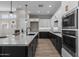 Gourmet kitchen with stainless steel appliances, sleek cabinetry, and a spacious island at 32470 N 134Th Ln, Peoria, AZ 85383