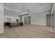 Large living area showing open kitchen and dining areas with plenty of natural light at 32470 N 134Th Ln, Peoria, AZ 85383