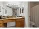 Double vanity bathroom with granite countertops and a large mirror at 3825 E Camelback Rd # 239, Phoenix, AZ 85018