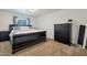 Main bedroom with a king-size bed and dresser at 3825 E Camelback Rd # 239, Phoenix, AZ 85018
