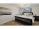King-size bed, plush bedding, and large wall art in this spacious bedroom at 3825 E Camelback Rd # 239, Phoenix, AZ 85018