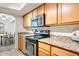 Modern kitchen features stainless steel appliances and granite countertops at 3825 E Camelback Rd # 239, Phoenix, AZ 85018