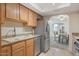 Spacious kitchen, granite counters, stainless steel appliances, and view to dining area at 3825 E Camelback Rd # 239, Phoenix, AZ 85018