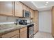 Modern kitchen with stainless steel appliances and granite countertops at 3825 E Camelback Rd # 239, Phoenix, AZ 85018