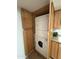 Convenient, stacked washer and dryer with cabinetry at 3825 E Camelback Rd # 239, Phoenix, AZ 85018